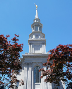 Photo of the Philadelphia Temple with red-leafed maple trees in the foreground